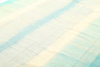 Soft aqua blue and ivory coastal rug surface detail
