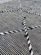 Close-up of braided diamond pattern on handwoven wool runner