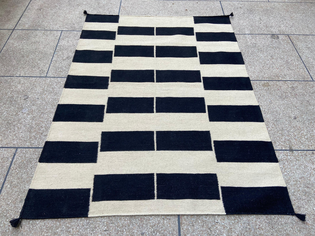 Black and ivory geometric handwoven wool kilim rug, full view