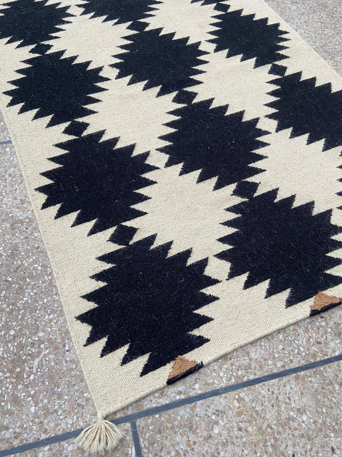 Close-up of black and ivory flatwoven wool kilim texture