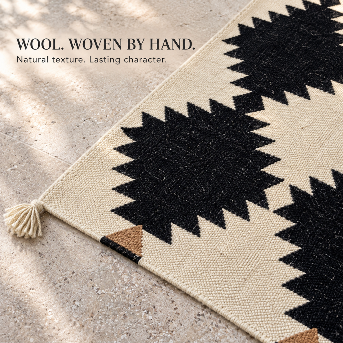 Handwoven wool texture and tassel detail