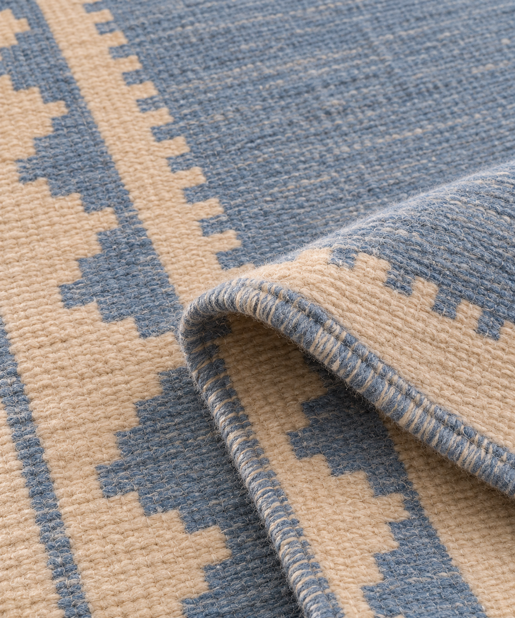 Folded close-up of blue and ivory handwoven wool runner