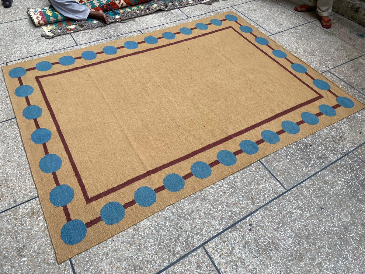 Camel and blue circle border handmade wool kilim rug
