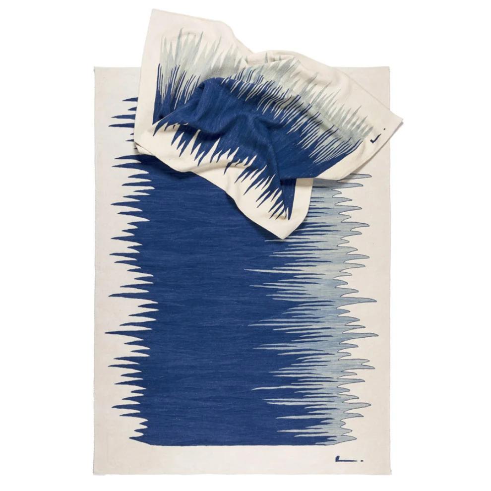 Folded indigo blue gradient wool kilim rug