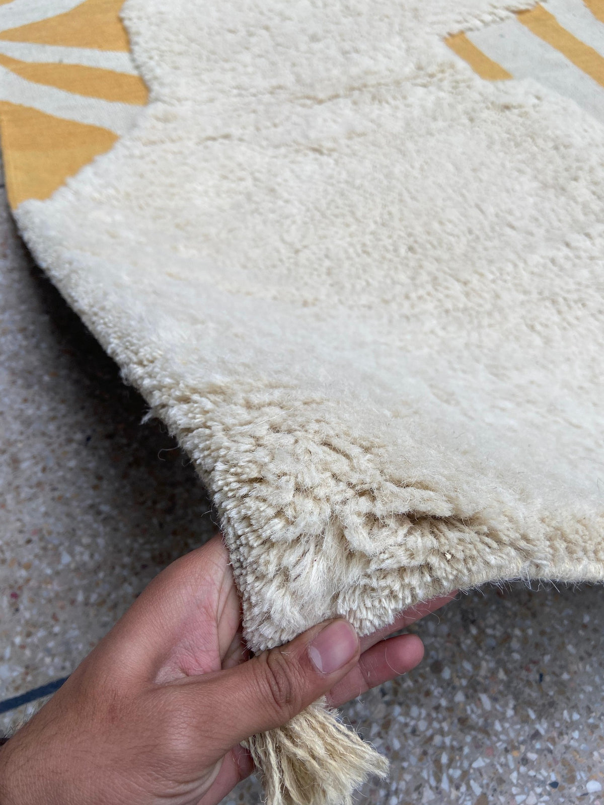 Close-up of ivory wool pile and mustard flatweave on Boujaad-inspired rug