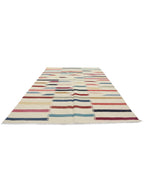 Modern multicolour striped flatweave area rug viewed from an angle