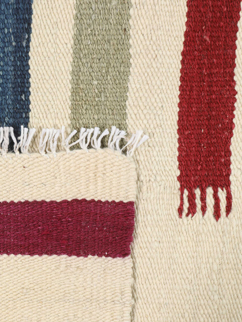 Reversible construction detail of handmade striped wool kilim
