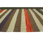 Close-up of ivory, brown, rust and purple stripes on wool flatweave rug