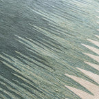 Close-up of sage green and ivory handwoven flatweave texture