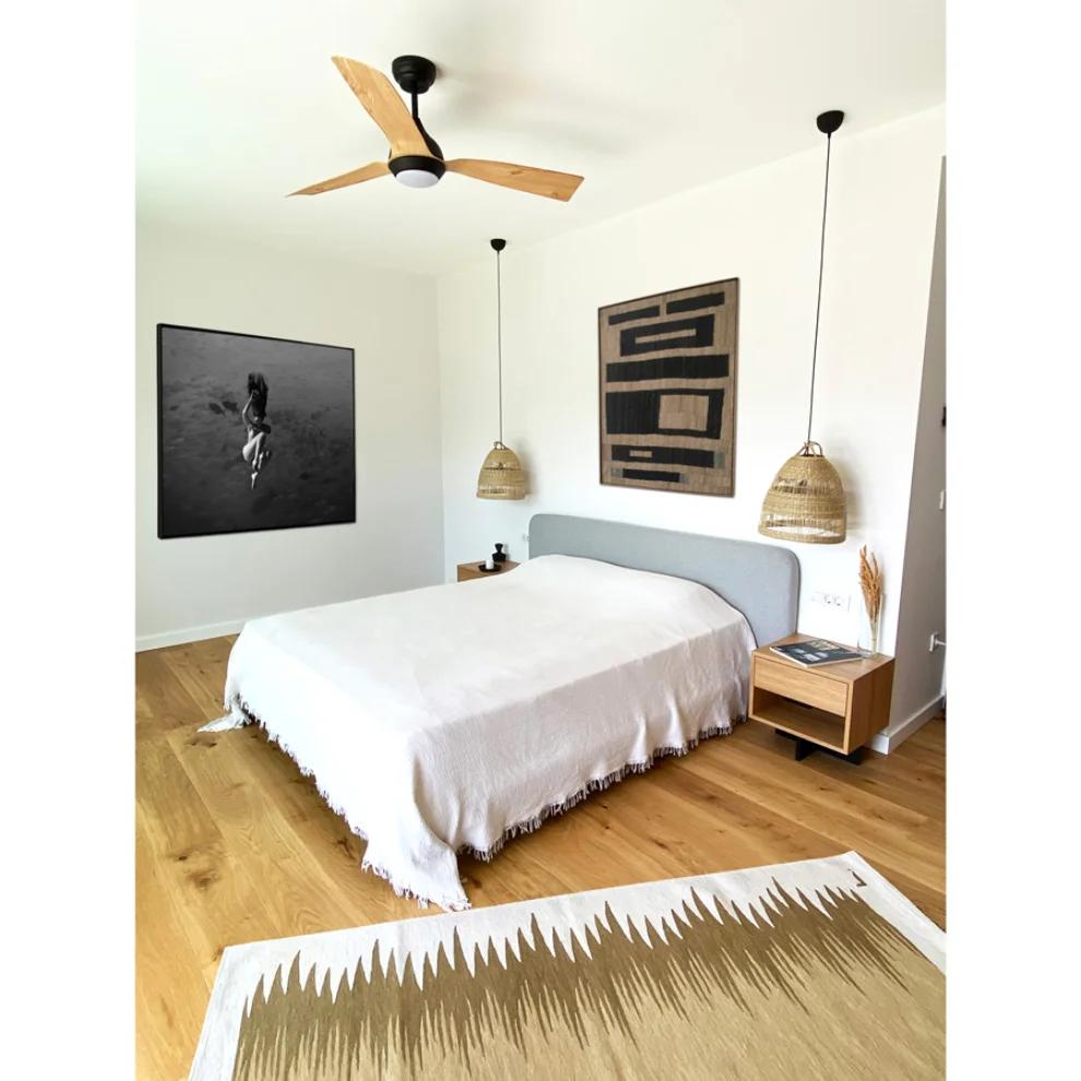 Sand and olive gradient kilim rug styled in a bedroom